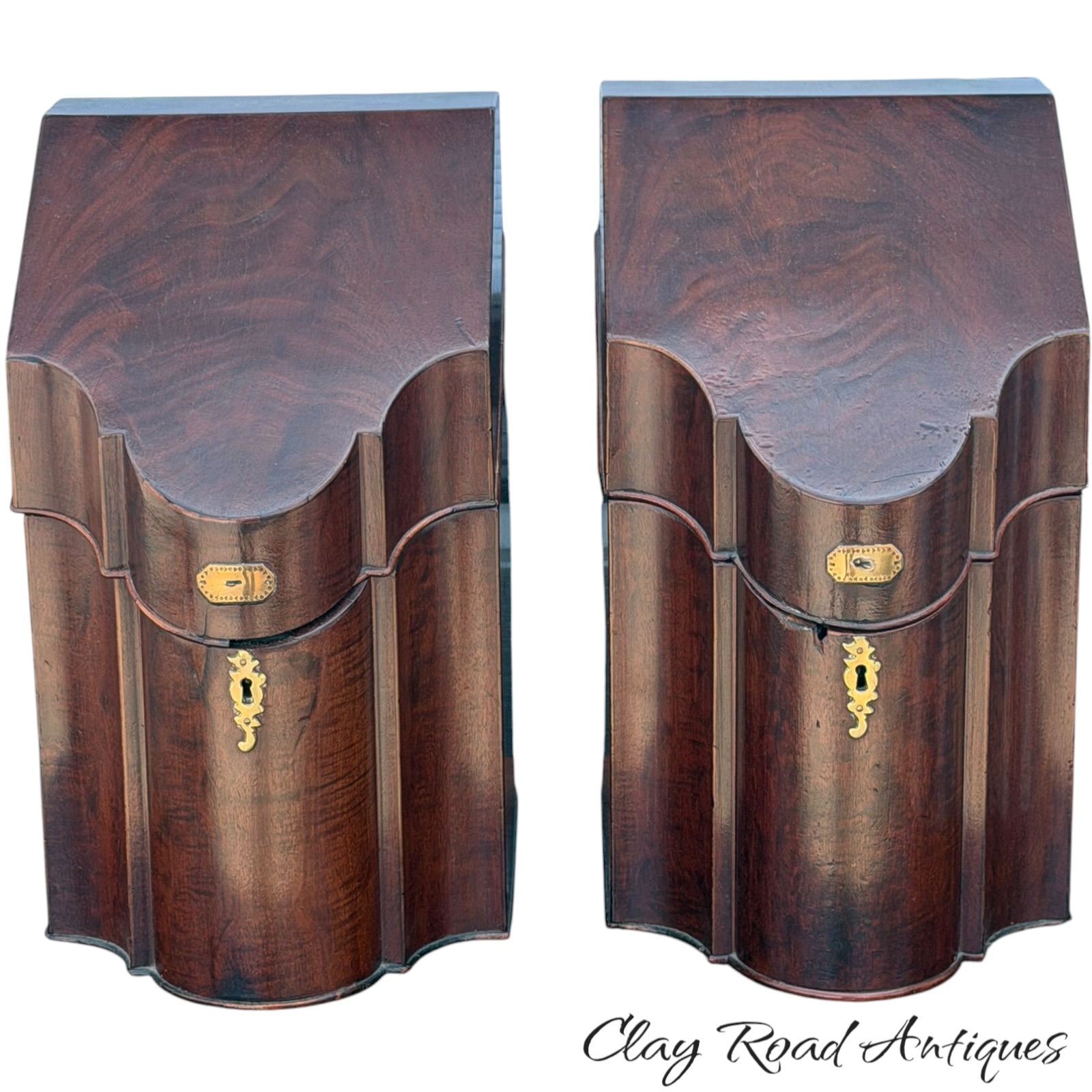 Pair of antique shaped wooden knife boxes with brass escutcheons