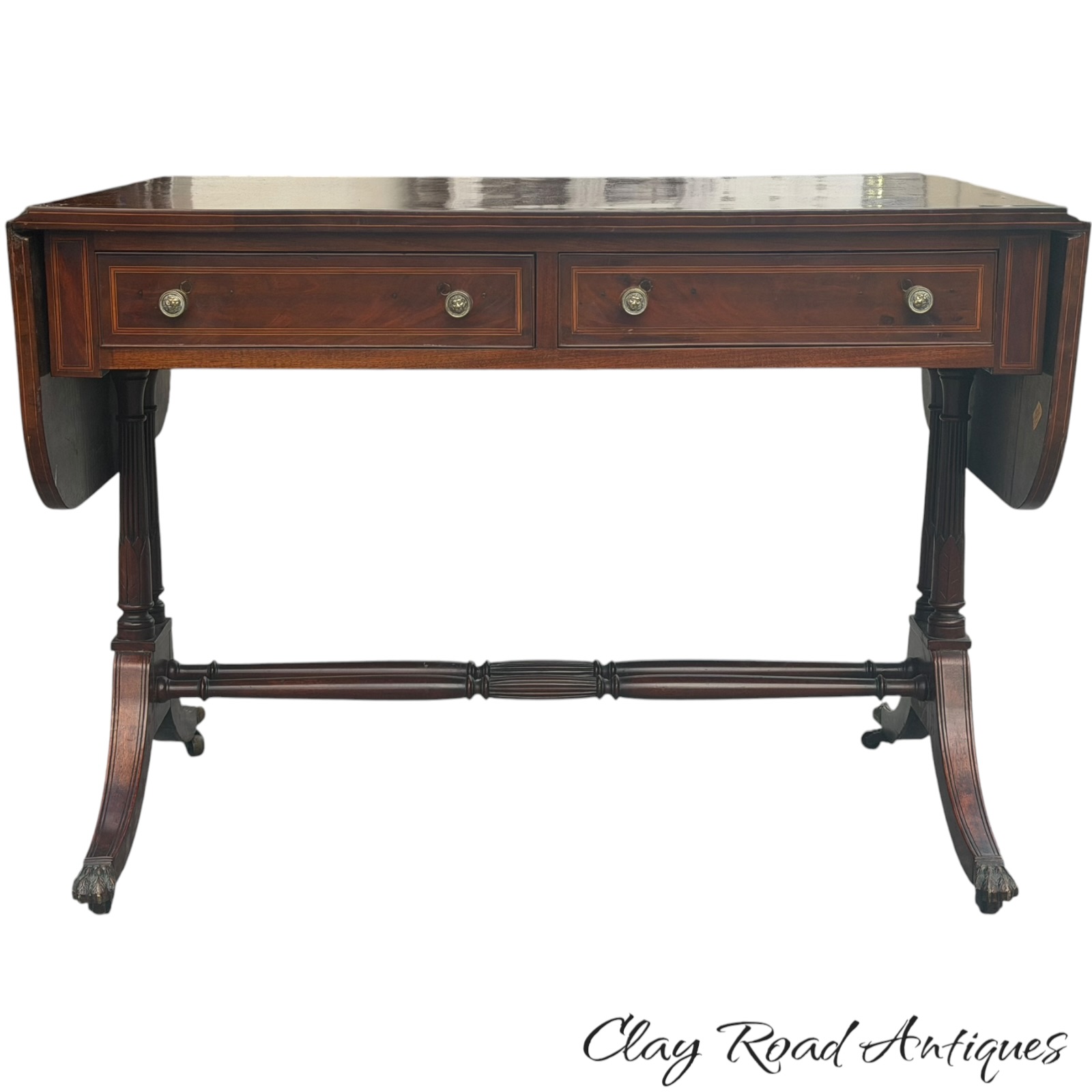 Antique drop-leaf table with two drawers and shaped feet